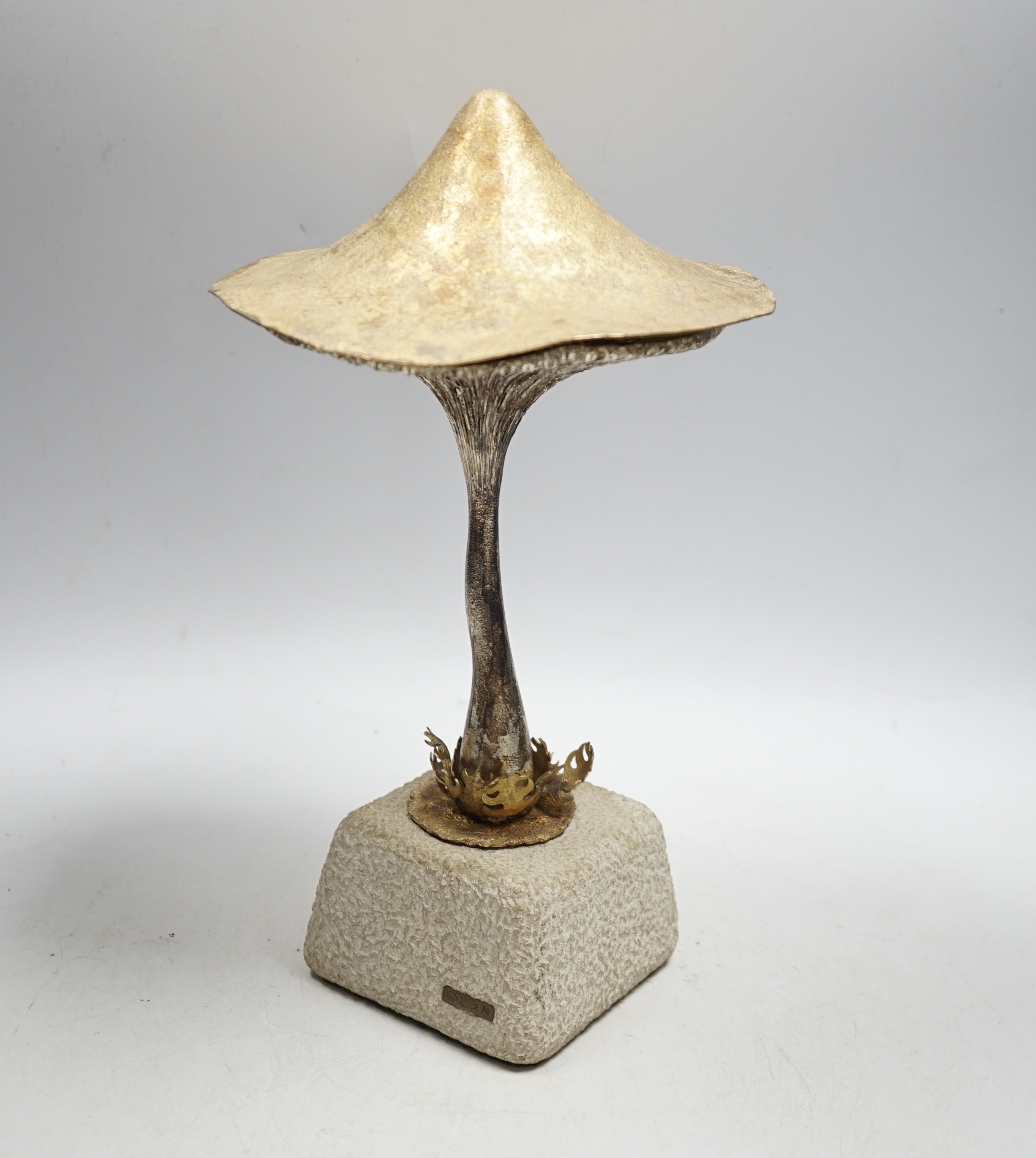 An Elizabeth II limited edition novelty surprise mushroom, by Christopher Nigel Lawrence, London, 1976, opening to reveal a pixie fishing, no.2/8, on a simulated rock base, overall height 29.5cm, with certificate.